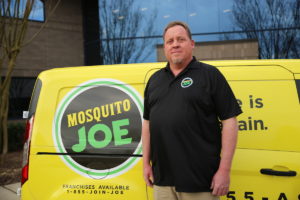 Mosquito Joe of Huntsville-Birmingham owner standing in front of Mosquito Joe van.